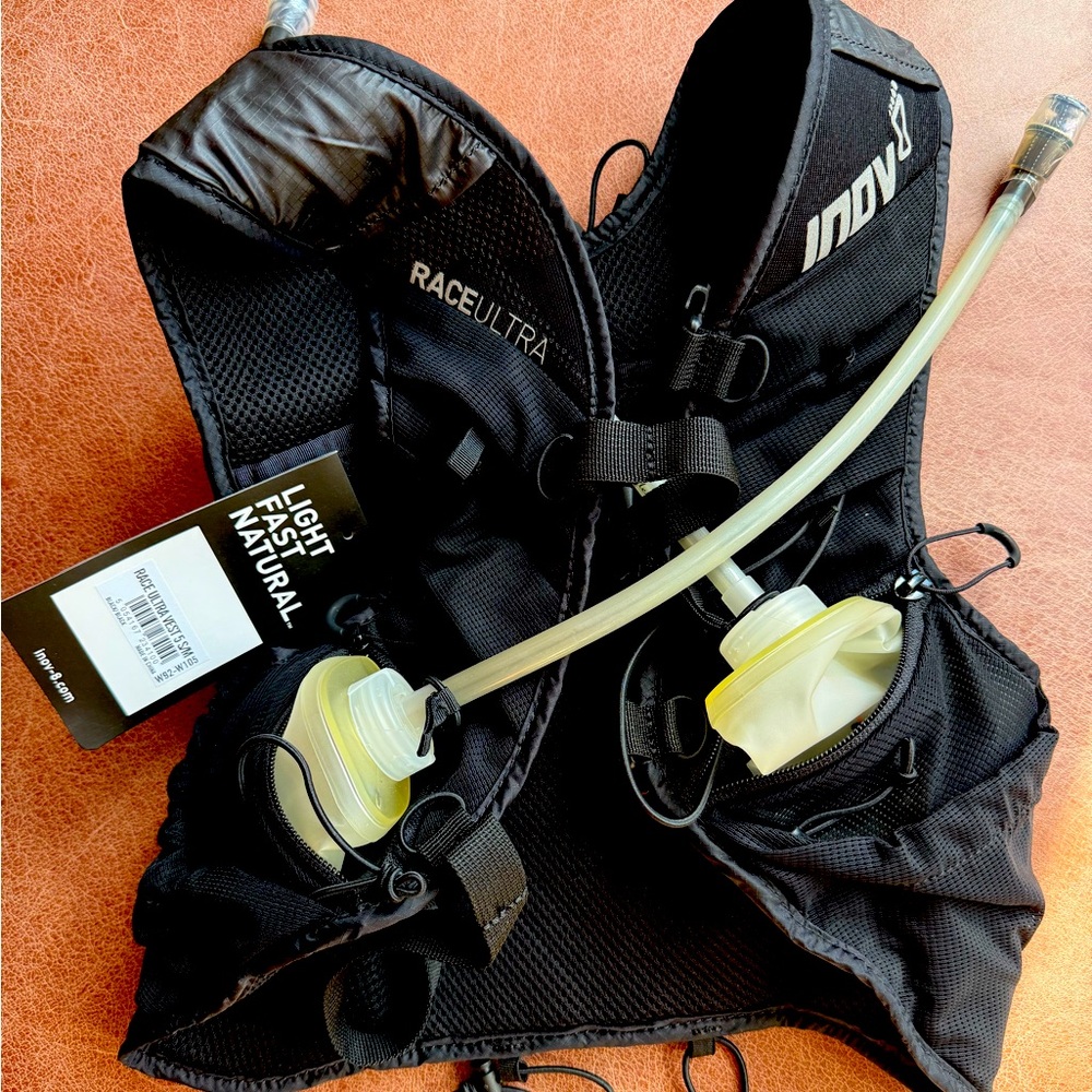 Inov-8 Race Ultra Hydration Vest. *new bottles have some discoloration see photo